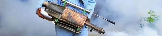 Fumigation technician using a fogger for deep pest treatment in Jersey City, NJ